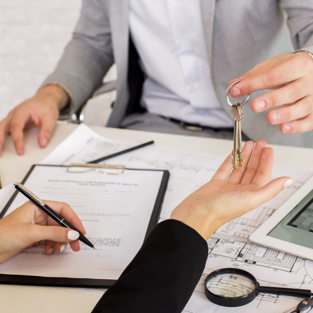 man-giving-some-keys-woman